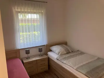 Ein Bett oder Betten in einem Zimmer der Unterkunft Havelstern Ketzin, Ferienhaus Plötze