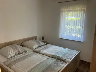 Ein Bett oder Betten in einem Zimmer der Unterkunft Havelstern Ketzin, Ferienhaus Barsch