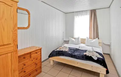 Ein Bett oder Betten in einem Zimmer der Unterkunft Fh Rot