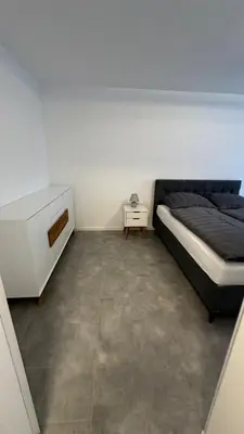 Ein Bett oder Betten in einem Zimmer der Unterkunft Sehr Schöne 2-Zimmer Wohnung mit Garten W184