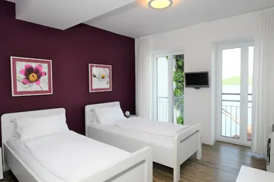 Ein Bett oder Betten in einem Zimmer der Unterkunft Ferienwohnung Helene