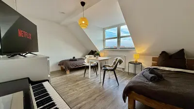 Ein Sitzbereich in der Unterkunft Modernes Apartment im Boho Style