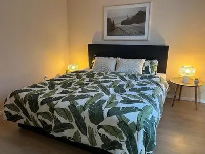 Ein Bett oder Betten in einem Zimmer der Unterkunft FeWo am Mainplatz