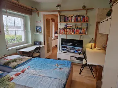 Ein Bett oder Betten in einem Zimmer der Unterkunft 2-Etagen-Wohnung im Haus am See von Berlin