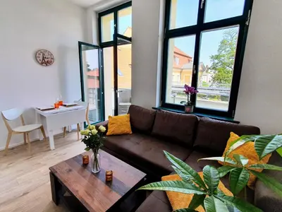 Ein Sitzbereich in der Unterkunft Hogulu - 2 - RAUM - App 23 mit Balkon im Herzen der Altstadt