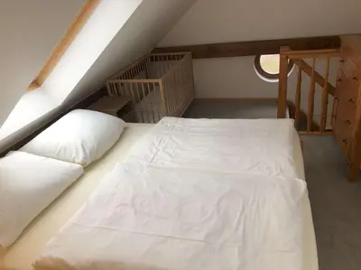 Ein Bett oder Betten in einem Zimmer der Unterkunft Ferienwohnung Wandersruh