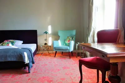 Ein Bett oder Betten in einem Zimmer der Unterkunft Schloss Blankensee Gästezimmer