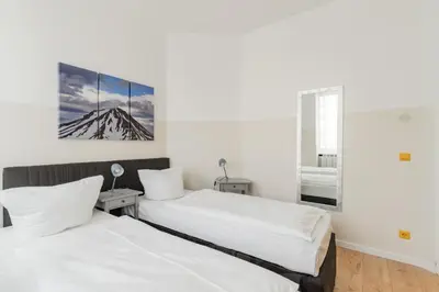 Ein Bett oder Betten in einem Zimmer der Unterkunft BIG Central City Apartments in Schöneberg