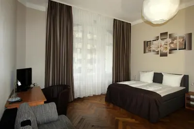 Ein Bett oder Betten in einem Zimmer der Unterkunft Hotel Elegia am Kurfürstendamm